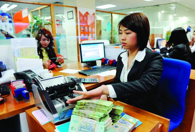 Chật vật tìm 'cửa' vay tiền Sau Tết, các ngân hàng vẫn chưa hết căng thanh khoản. Ảnh: Hồng Vĩnh