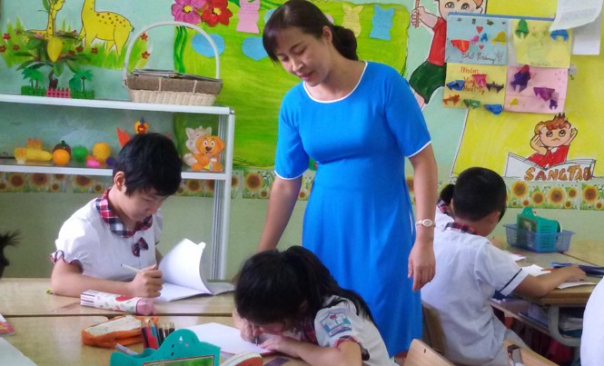 Đã đến thời sách giáo khoa không còn là 'thánh chỉ' Thời gian tới, SGK không còn là “thánh chỉ” đối với GV và học sinh. Ảnh: Nghiêm Huê.