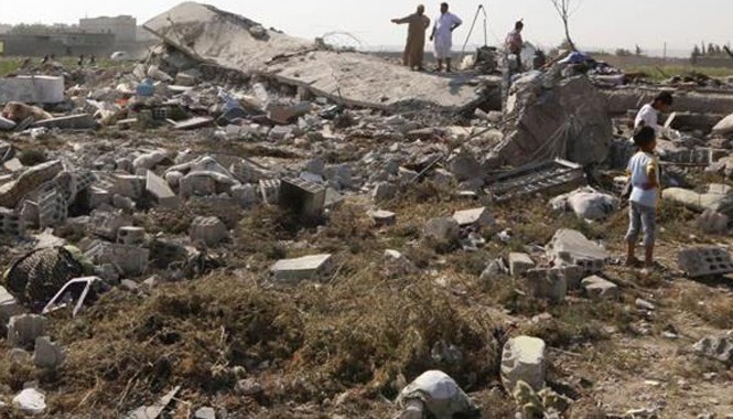 Rơi máy bay quân sự tại Syria, 35 binh sỹ thiệt mạng Ảnh hiện trường một máy bay quân sự Syria rơi ở thành phố Raqqa hồi tháng 9/2014 (Ảnh: Press TV)