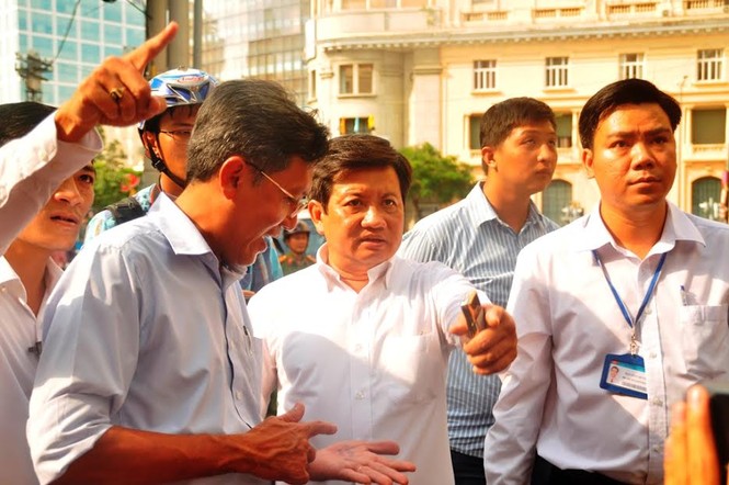 Quận 1 tháo dỡ vọng gác công an, cắt xích rào của Ngân hàng Nhà nước - ảnh 18