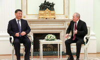 Tổng thống Nga Vladimir Putin và Chủ tịch Trung Quốc Tập Cận Bình trong cuộc trao đổi ngày 20/3. (Ảnh: Tass)