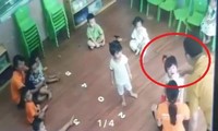 Phụ huynh đánh trẻ 2 tuổi trong lớp học (ảnh cắt từ clip).