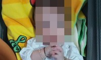 Bé trai 7 tháng tuổi bị bỏ rơi ven đường cùng 2 bình sữa pha sẵn