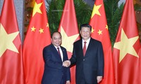Thủ tướng Nguyễn Xuân Phúc và Tổng Bí thư, Chủ tịch Trung Quốc Tập Cận Bình. Ảnh: VGP/Quang Hiếu