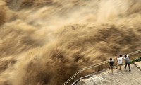 Mưa lũ khiến mực nước hàng trăm sông ở Trung Quốc vượt mức cảnh báo. Ảnh: China Daily