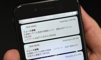 Tin nhắn báo động nhầm của NHK được gửi đi lúc 18h55' ngày 16/1. Tin đính chính được gửi lúc 19h. Ảnh: AP