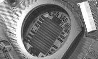Ảnh vệ tinh hôm 12/8 cho thấy hàng trăm phương tiện giống xe bọc thép tập trung tại một sân vận động ở Thâm Quyến. Ảnh: Maxar's WorldView