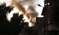 Thị trấn Ras al-Ain của Syria chìm trong khói lửa. Ảnh: Sputnik