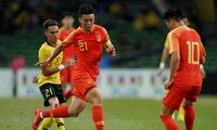 Hu Jinghang (giữa) không bận tâm chuyện HLV Guus Hiddink đã rời U23 Trung Quốc.