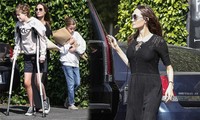 Con gái Angelina Jolie chống nạng cùng mẹ và em xuống phố sau phẫu thuật