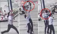 Clip người qua đường đỡ được bé gái 2 tuổi rơi từ cửa sổ căn hộ tầng 5 ở Trung Quốc