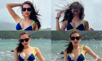 Ảnh hậu trường phía sau màn tạo dáng với bikini của Hoa hậu Thùy Tiên khiến fan cười ngất