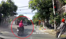 Clip: Vượt đèn đỏ, người phụ nữ bị xe ô tô tông văng lên nắp capo
