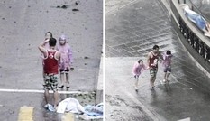Bố bắt hai con nhỏ đứng tạo dáng giữa siêu bão Mangkhut để chụp ảnh