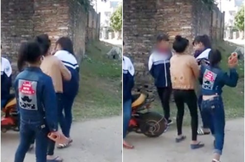 Nữ sinh bị bạn dùng gạch hành hung đến ngất xỉu Nhóm nữ sinh cầm gạch hành hung bạn giữa ban ngày. Ảnh cắt từ video