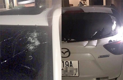 Bắn vỡ kính, vung kiếm 'chém nát' ôtô của đối thủ kinh doanh Phía kính trước và sau xe Mazda CX5 đều bị hư hỏng nặng