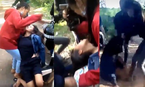 Nữ sinh cầm đầu nhóm đánh bạn lớp 9 ngất xỉu đã bỏ trốn Nhóm học sinh rất đông vây đánh em Q vào chiều 16.6. Ảnh: Cắt từ clip