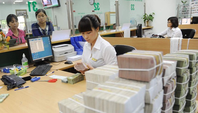 Vì sao 3 ngân hàng bị mua giá 0 đồng? Nợ xấu có thể mua nhưng không thể bán ngay. Ảnh: Hồng Vĩnh.