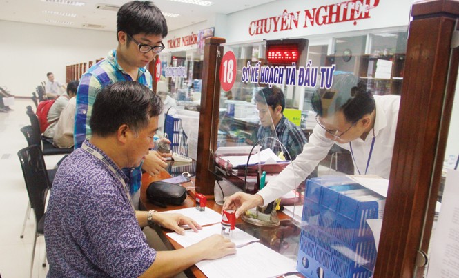 Công bố PCI 2016: Vẫn lo ngại phí bôi trơn, hoa hồng Đà Nẵng đặc biệt quan tâm đến cải cách thủ tục hành chính, tạo môi trường đầu tư tốt giúp doanh nghiệp phát triển. Ảnh: PV.