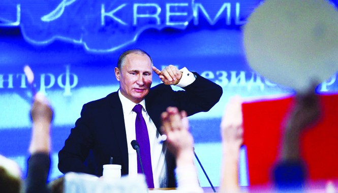 Đồng rúp bật dậy mạnh mẽ Tổng thống Nga Vladimir Putin thảo luận khủng hoảng tiền tệ, tình hình Ukraine và quan hệ với phương Tây trong cuộc họp báo cuối năm 2014. Ảnh: Getty Images