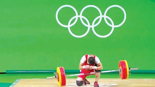 Giải mã thất bại của Thạch Kim Tuấn ở Olympic Thạch Kim Tuấn thất bại ở nội dung cử đẩy hạng cân 56kg.