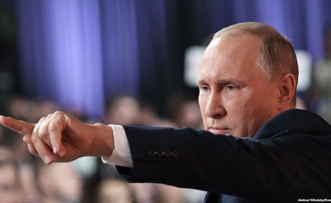 Chiến thắng Syria rộng đường cho ông Putin trước mùa bầu cử Tổng thống Nga Vladimir Putin tại cuộc họp báo cuối năm ngày 14/12. Ảnh: TASS