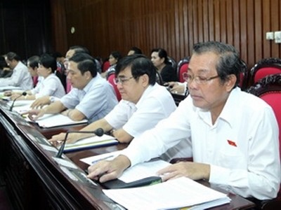 Văn phòng Chủ tịch nước công bố 4 luật, 1 pháp lệnh Các đại biểu ấn nút biểu quyết Luật phòng, chống khủng bố ngày 12/6/2013. Ảnh: Nhan Sáng/TTXVN