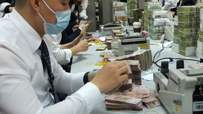 Ngân hàng có lãi nhờ nhặt bạc lẻ Bức tranh lợi nhuận ngân hàng 2013 vẫn chưa sáng sủa. Ảnh: Thanh Lan.