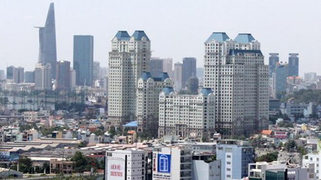 Bất động sản 2015 đặt cược vào đòn bẩy chính sách Theo các chuyên gia, sự hỗ trợ tích cực từ hàng loạt các chính sách mới sắp có hiệu lực vào năm 2015 sẽ góp phần tháo gỡ khó khăn và vướng mắc tâm lý cho thị trường bất động sản. Ảnh: Vũ Lê/ VnExpress