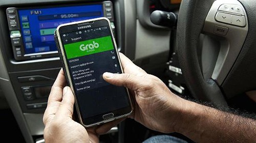 Nỗi lo Grab thao túng giá taxi khi không còn Uber Grab sẽ "một mình một ngựa" khi không còn đối thủ trực tiếp Uber. Ảnh: CNBC.