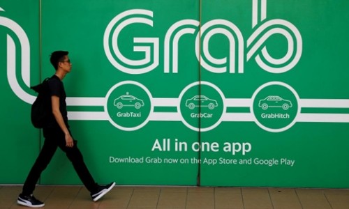 Toyota đổ một tỷ USD vào Grab Bên ngoài một văn phòng của Grab tại Singapore. Ảnh: Reuters