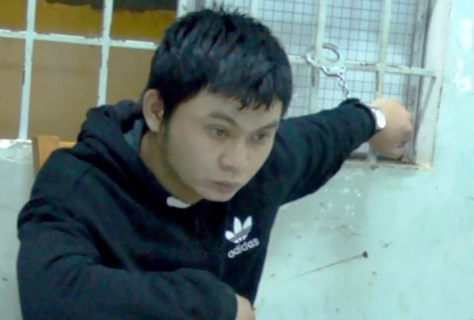 Cuộc tình 9 năm của nghi can giết người yêu chặt xác phi tang Nghi can Vũ Ngọc Hiếu tại cơ quan công an.