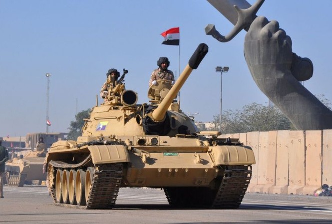 Quân đội Iraq diễu binh mừng đánh bại IS Xe tăng của quân đội Iraq tham gia diễu binh hôm qua, 10/12 tại thủ đô Baghdad. Ảnh: Reuters
