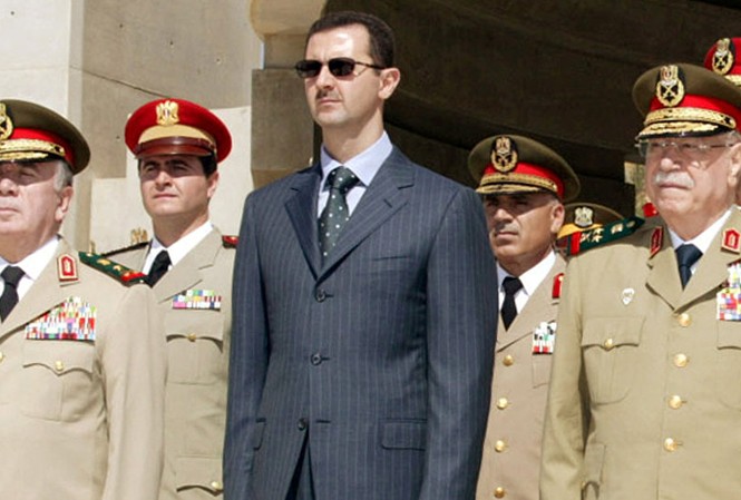Nhờ vũ khí Nga, Tổng thống Syria tuyên bố ‘không còn sợ NATO’ Tổng thống Syria Bashar al-Assad (áo đen). Ảnh: Sputnik