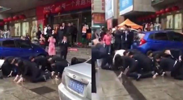 Hơn chục nhân viên bò trên đường vì... không đạt doanh số Ảnh: Shanghaiist
