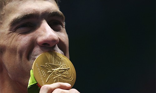 HCV Olympic và gánh nặng thuế với các siêu sao Mỹ Những VĐV đỉnh cao như Phelps không chỉ mang vinh quang về cho nước Mỹ, mà còn đóng góp ngân sách nước này thông qua tiền thuế thu nhập. Ảnh: Reuters.
