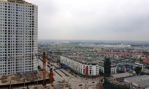 Thuế Tài sản với nhà đất, căn hộ chung cư tính như thế nào? Một dự án khu đô thị gồm cả chung cư và nhà thấp tầng tại Hà Nội. Ảnh: Nguyễn Hà.