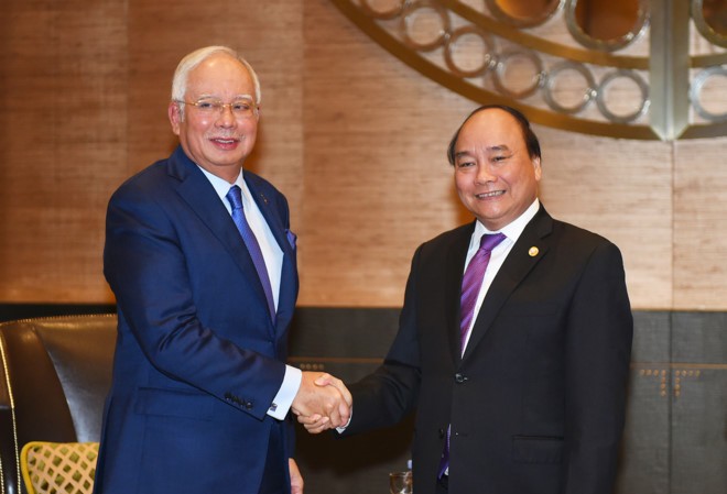 Thủ tướng Malaysia nói Đoàn Thị Hương sẽ được xử công bằng Thủ tướng Nguyễn Xuân Phúc và Thủ tướng Malaysia Najib Razak. Ảnh: VGP/Quang Hiếu.