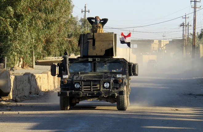 Bản tin 20H: 40 phiến quân IS bị tiêu diệt khi tấn công Iraq Binh sỹ chống khủng bố Iraq làm nhiệm vụ tại khu vực ngoại ô Ramada ngày 13/1. (Nguồn: AFP/TTXVN)