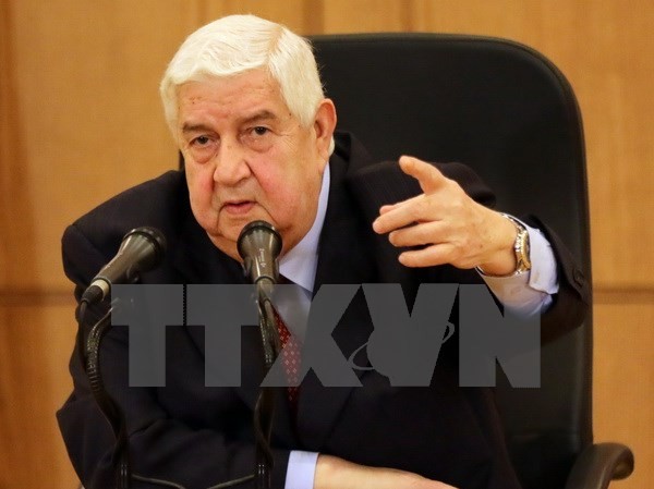 BẢN TIN sáng: Syria tố Mỹ cố ý không kích binh sĩ Ngoại trưởng Syria Walid Muallem. (Ảnh: AFP/TTXVN)