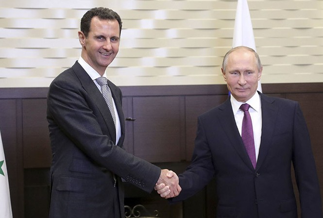 Tổng thống Nga và Syria nói gì trong cuộc hội đàm 4 tiếng đồng hồ? Tổng thống Nga Vladimir Putin gặp người đồng cấp Syria Bashar Assad tại Sochi hôm 20/11. Ảnh: Reuters