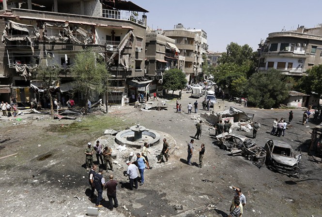 Syria tự tin đủ mạnh để khôi phục cơ sở hạ tầng bị hủy hoại Khu vực phía đông thủ đô Damascus bị đánh bom tự sát hồi 2/7. Ảnh: AP