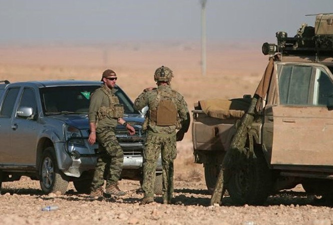 Tổng thống Trump: 'Mỹ không kích chống quân đội Syria' Lính Mỹ xuất hiện ở gần thành phố Raqqa, Syria. Ảnh: Reuters