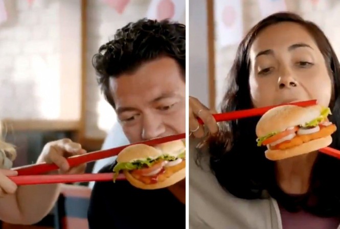 Bị chỉ trích, Burger King phải rút quảng cáo về bánh kiểu Việt Nam Hình ảnh nhân vật ăn bánh burger bằng đôi đũa màu đỏ cỡ lớn. (Ảnh chụp từ clip)