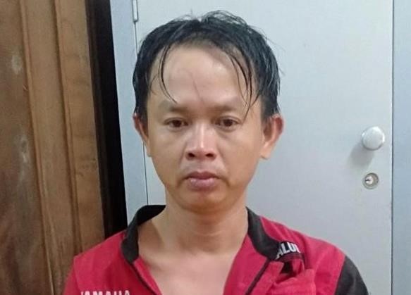 Kẻ cướp tiệm vàng yêu cầu được che mặt khi bị bắt Bị can Nguyễn Trọng Nhân