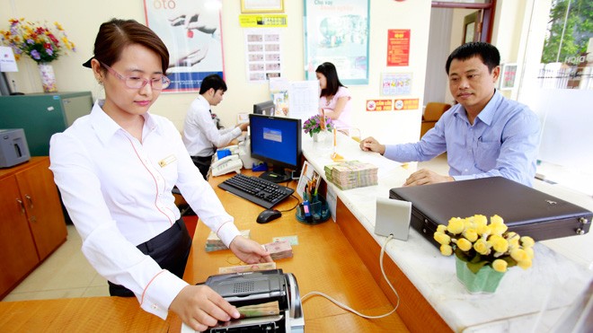 Áp lực nợ xấu Xử lý, bán lại các khoản nợ xấu đã mua sẽ là áp lực lớn đối với VAMC trong năm 2014. Ảnh: Như Ý