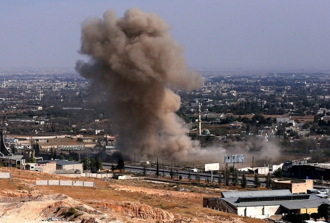 Nga tổng kết 1 tháng chiến dịch không kích ở Syria Một mục tiêu khủng bố bị phá hủy trong chiến dịch không kích của không quân Nga. Ảnh: Tass