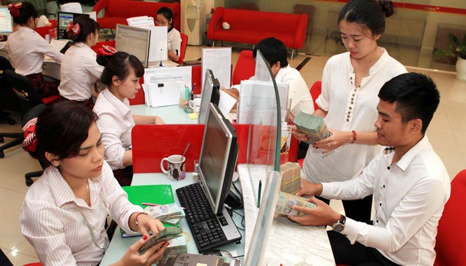 Nợ xấu: Bán nhanh về đích Nợ xấu ngân hàng giảm nhanh nhờ bán nợ. Ảnh: Trần Việt.