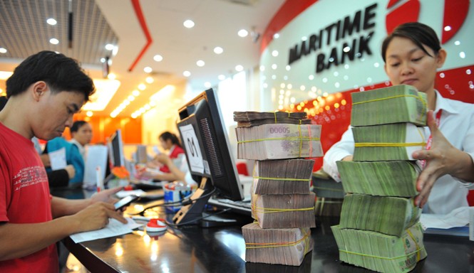 Ngân hàng Việt: Lo gì khi hội nhập? Gia nhập cộng đồng ASEAN, ngân hàng phải xử lý khối lượng lớn vốn lưu chuyển. Ảnh: P.V.