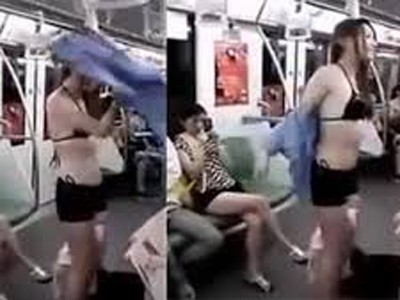 Hotgirl thản nhiên thay váy trên tàu điện Hotgirl thản nhiên thay váy trên tàu điện